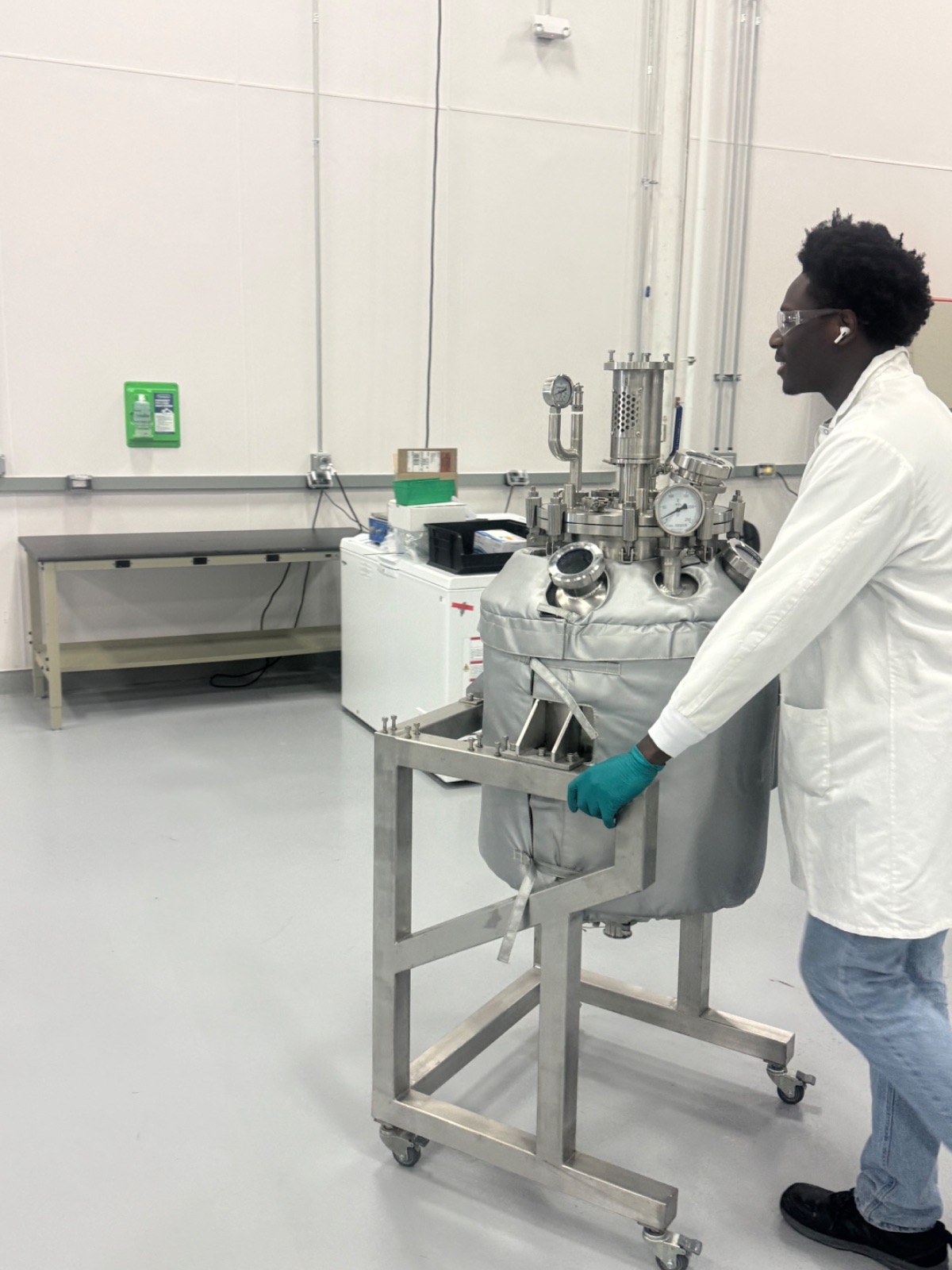 Capra scientist working with a benchtop reactor